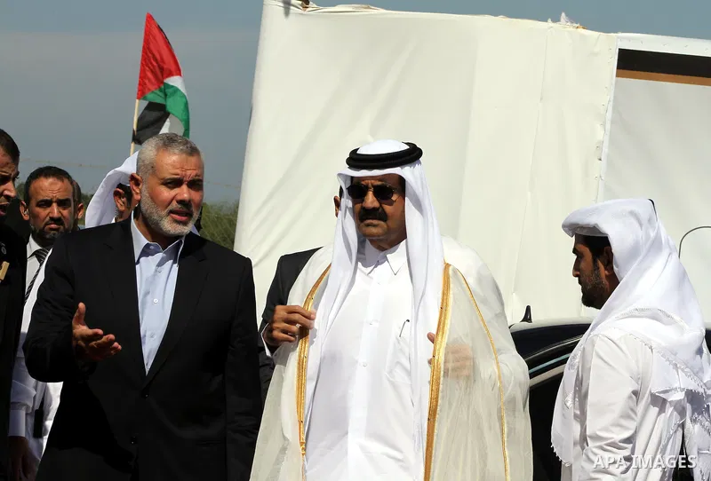 Palestinian Prime Minister in Gaza Strip, Ismail Haniyeh with the Emir of Qatar Sheik Hamad bin Khalifa al-Thani arrive to attend the opening ceremony for housing project in the southern Gaza Strip town of Khan Yunis, Oc...