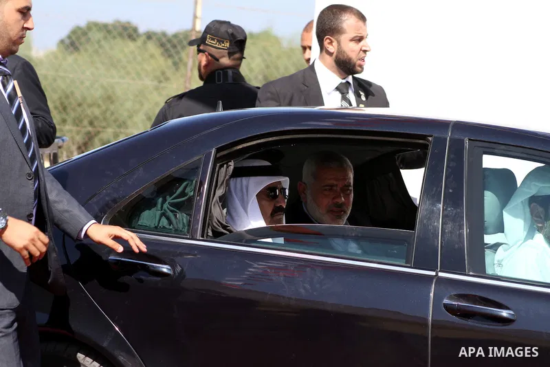 Palestinian Prime Minister in Gaza Strip, Ismail Haniyeh with the Emir of Qatar Sheik Hamad bin Khalifa al-Thani arrive to attend the opening ceremony for housing project in the southern Gaza Strip town of Khan Yunis, Oc...