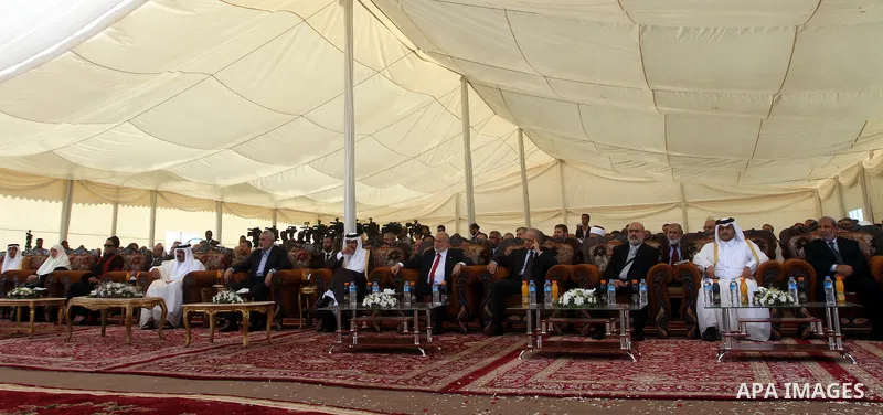 Palestinian Prime Minister in Gaza Strip, Ismail Haniyeh with the Emir of Qatar Sheik Hamad bin Khalifa al-Thani arrive to attend the opening ceremony for housing project in the southern Gaza Strip town of Khan Yunis, Oc...