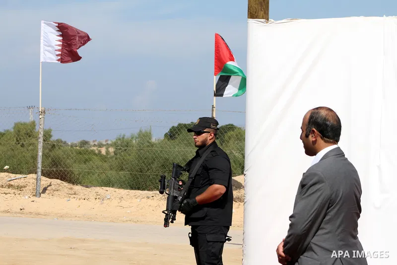 A member of security forces stand guard as Palestinian Prime Minister in Gaza Strip, Ismail Haniyeh with the Emir of Qatar Sheik Hamad bin Khalifa al-Thani arrive to attend the opening ceremony for housing project in the...
