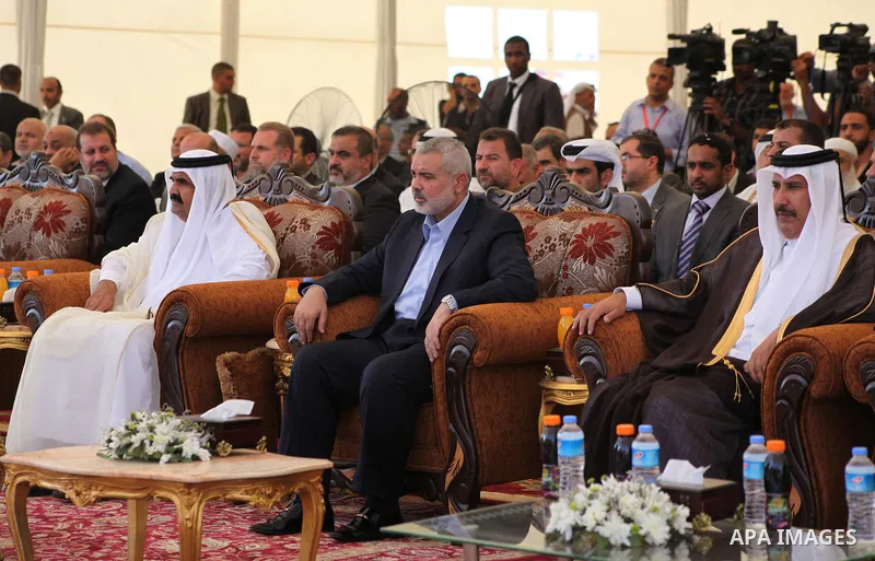 Palestinian Prime Minister in Gaza Strip, Ismail Haniyeh with the Emir of Qatar Sheik Hamad bin Khalifa al-Thani arrive to attend the opening ceremony for housing project in the southern Gaza Strip town of Khan Yunis, Oc...