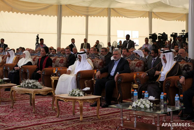 Palestinian Prime Minister in Gaza Strip, Ismail Haniyeh with the Emir of Qatar Sheik Hamad bin Khalifa al-Thani arrive to attend the opening ceremony for housing project in the southern Gaza Strip town of Khan Yunis, Oc...