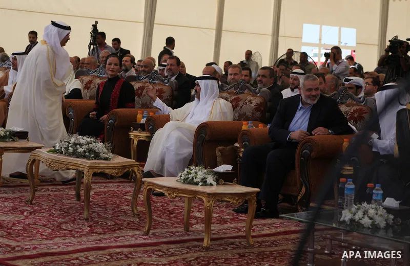 Palestinian Prime Minister in Gaza Strip, Ismail Haniyeh with the Emir of Qatar Sheik Hamad bin Khalifa al-Thani arrive to attend the opening ceremony for housing project in the southern Gaza Strip town of Khan Yunis, Oc...