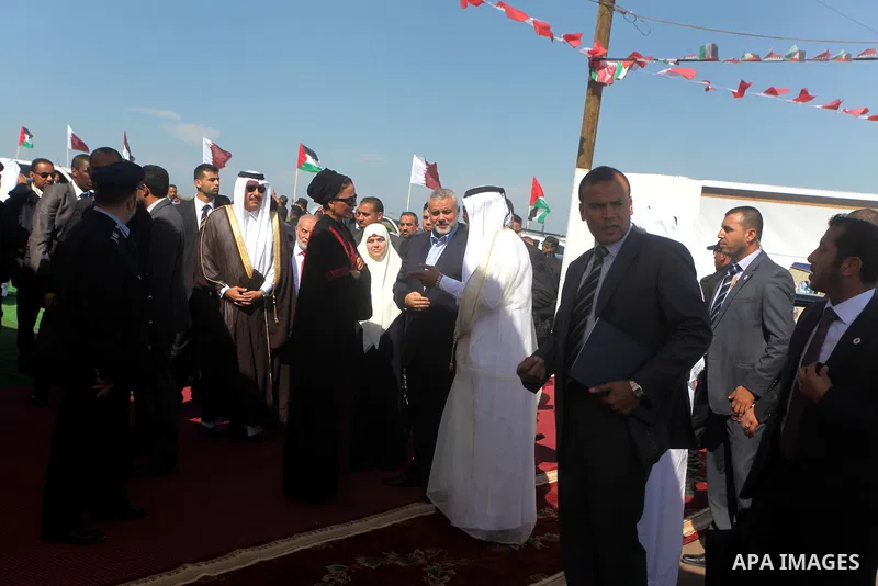 Palestinian Prime Minister in Gaza Strip, Ismail Haniyeh with the Emir of Qatar Sheik Hamad bin Khalifa al-Thani arrive to attend the opening ceremony for housing project in the southern Gaza Strip town of Khan Yunis, Oc...