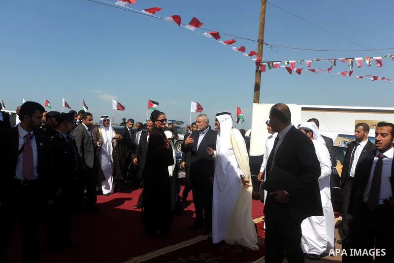Palestinian Prime Minister in Gaza Strip, Ismail Haniyeh with the Emir of Qatar Sheik Hamad bin Khalifa al-Thani arrive to attend the opening ceremony for housing project in the southern Gaza Strip town of Khan Yunis, Oc...