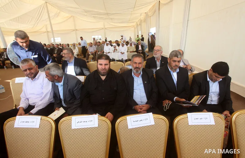 Palestinian leaders attend the opening ceremony for housing project in the southern Gaza Strip town of Khan Yunis, October 23, 2012. The Emir of Qatar entered the Gaza Strip on Tuesday for a visit that broke the isolatio...