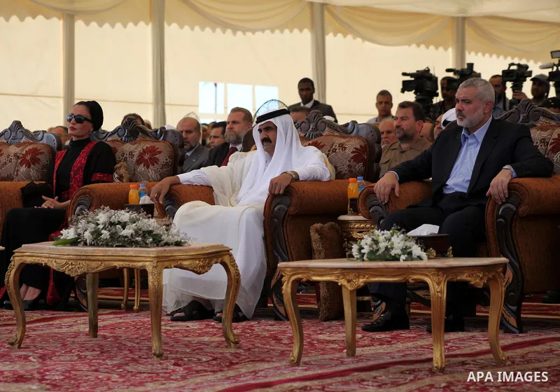Palestinian Prime Minister in Gaza Strip, Ismail Haniyeh with the Emir of Qatar Sheik Hamad bin Khalifa al-Thani arrive to attend the opening ceremony for housing project in the southern Gaza Strip town of Khan Yunis, Oc...