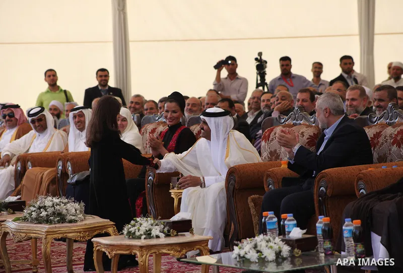 Palestinian Prime Minister in Gaza strip, Ismail Haniyeh and the Emir of Qatar Sheikh Hamad bin Khalifa al-Thani arrive at a cornerstone laying ceremony for Hamad, a new residential neighbourhood in Khan Younis in the so...