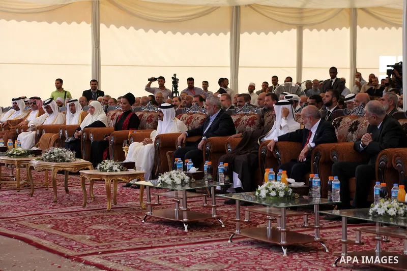 Palestinian Prime Minister in Gaza strip, Ismail Haniyeh and the Emir of Qatar Sheikh Hamad bin Khalifa al-Thani arrive at a cornerstone laying ceremony for Hamad, a new residential neighbourhood in Khan Younis in the so...