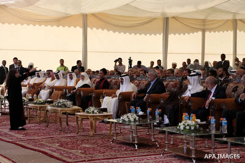 Palestinian Prime Minister in Gaza strip, Ismail Haniyeh and the Emir of Qatar Sheikh Hamad bin Khalifa al-Thani arrive at a cornerstone laying ceremony for Hamad, a new residential neighbourhood in Khan Younis in the so...