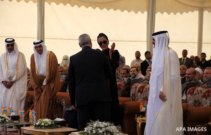 Palestinian Prime Minister in Gaza strip, Ismail Haniyeh and the Emir of Qatar Sheikh Hamad bin Khalifa al-Thani arrive at a cornerstone laying ceremony for Hamad, a new residential neighbourhood in Khan Younis in the so...
