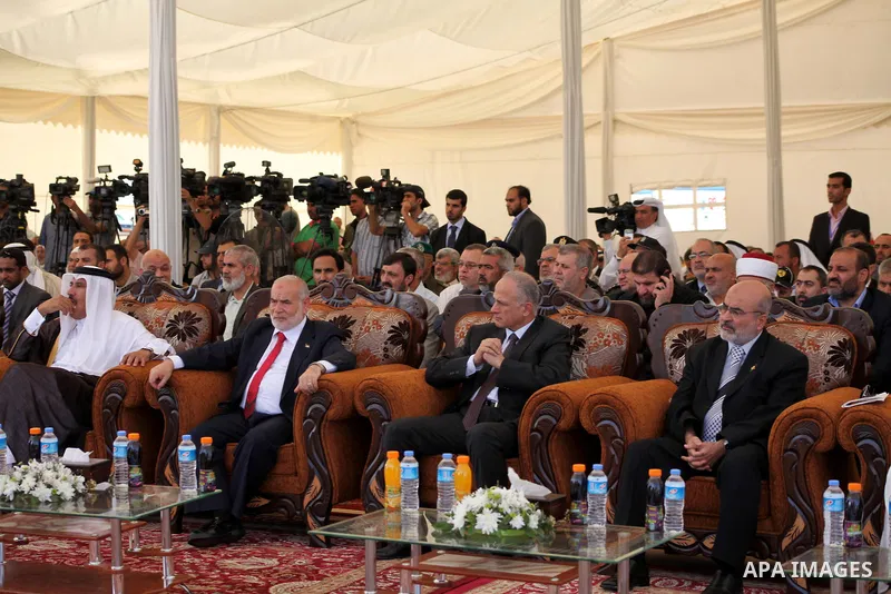 Egyptian Education Miinister (C) attends a cornerstone laying ceremony for Hamad, a new residential neighbourhood in Khan Younis in the southern Gaza Strip, 23 October 2012. The Emir of Qatar entered the Gaza Strip on Tu...