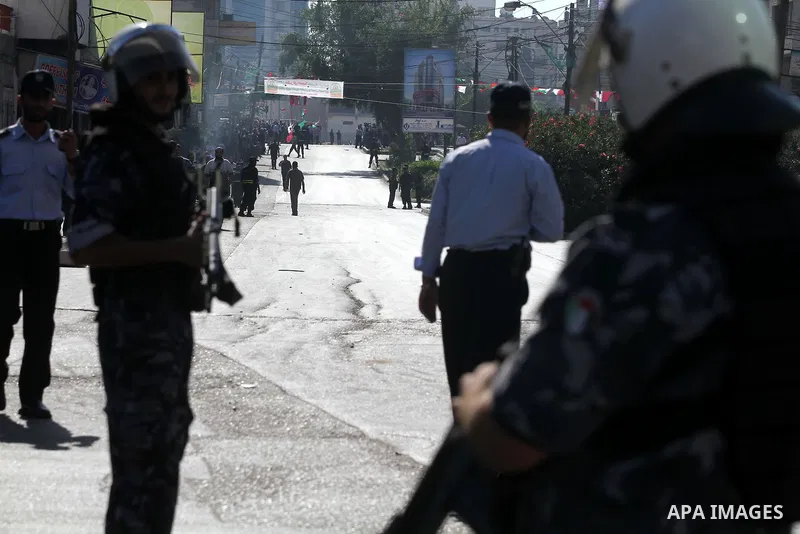 Palestinian Hamas security officers guard a road as they wait for the convoy of the Qatari Emir Sheikh Hamad bin Khalifa Al-Thani to arrive in Gaza City, Tuesday, Oct. 23,2012. The Emir of Qatar entered the Gaza Strip on...
