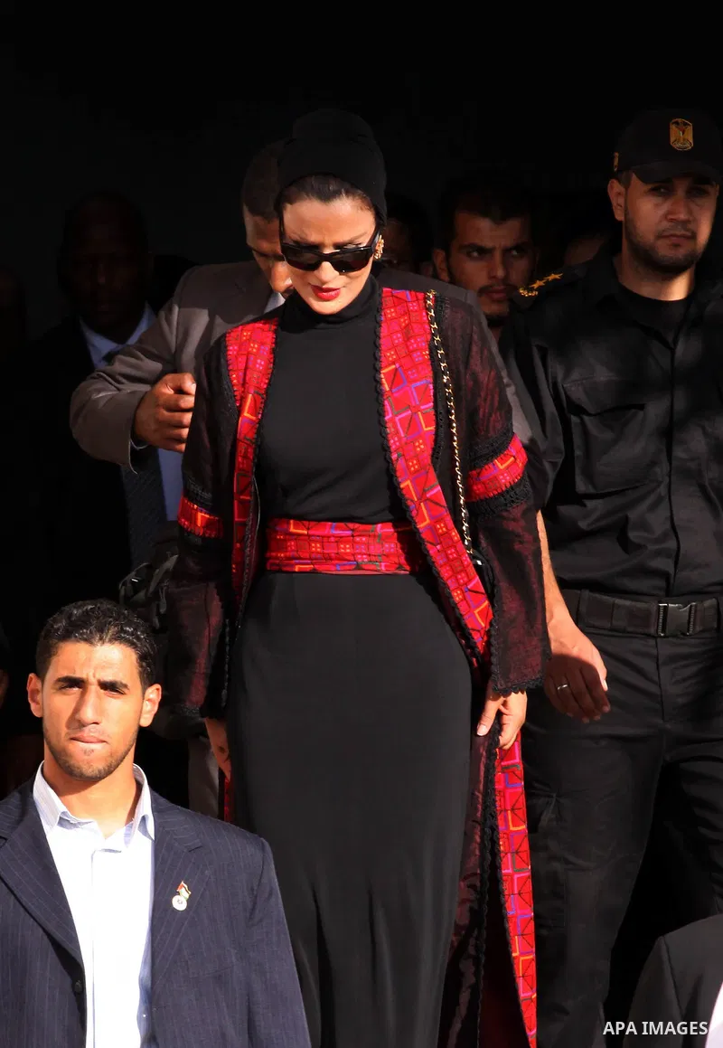 Qatar's First Lady Sheikha Mozah bint Nasser al-Missned leaves the Atfaluna Society for Deaf Children in the Gaza Strip on October 23, 2012. The Emir of Qatar entered the Gaza Strip on Tuesday for a visit that broke the...