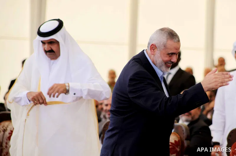 Palestinian Prime Minister in Gaza strip, Ismail Haniyeh and the Emir of Qatar Sheikh Hamad bin Khalifa al-Thani arrive at a cornerstone laying ceremony for Hamad, a new residential neighbourhood in Khan Younis in the so...