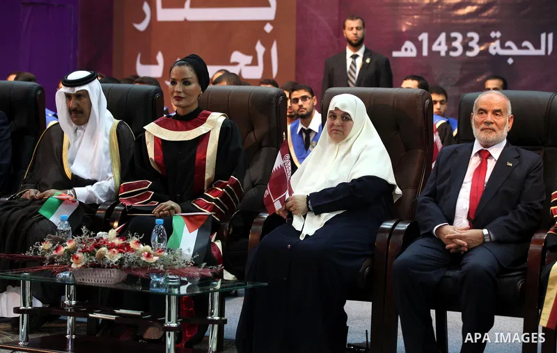Qatar's First Lady Sheikha Mozah bint Nasser al-Missned sits with the wife of Gaza's prime minister Ismail Haniyah during a celebration at the Islamic University in Gaza city on October 23, 2012. The Emir of Qatar entere...