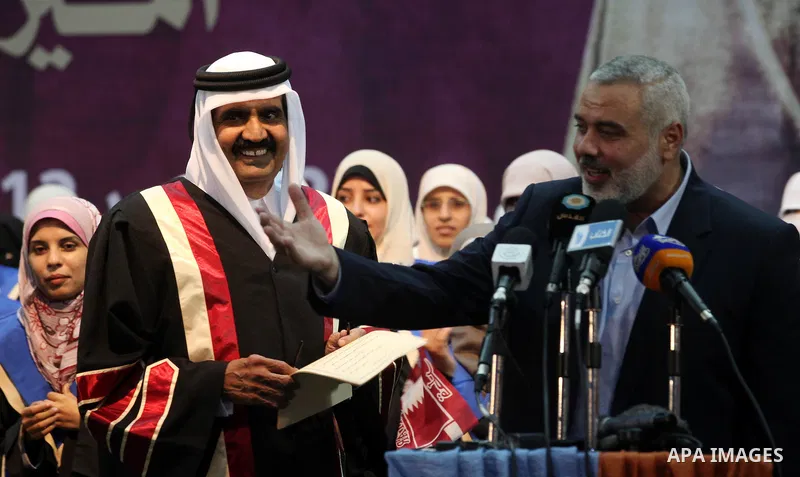 Qatari Emir Sheikh Hamad bin Khalifa al-Thani, Palestinian prime minister in Gaza strip, Ismail Haniyah attend a celebration at the Islamic University in Gaza city on October 23, 2012. The Emir of Qatar entered the Gaza...