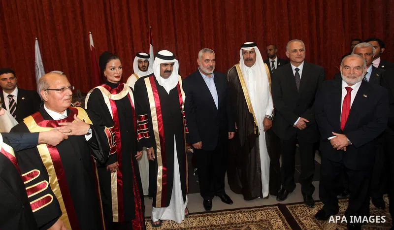 Qatari Emir Sheikh Hamad bin Khalifa al-Thani, Palestinian prime minister in Gaza strip, Ismail Haniyah and Qatar's First Lady Sheikha Mozah bint Nasser al-Missned attend a celebration at the Islamic University in Gaza c...