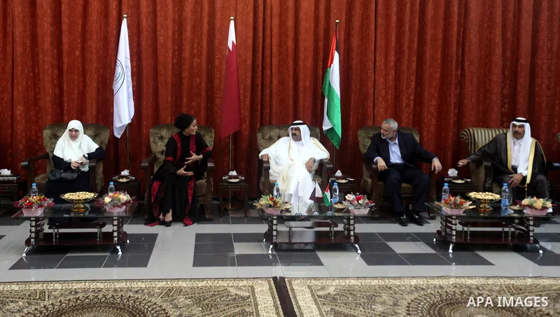 Qatari Emir Sheikh Hamad bin Khalifa al-Thani, Palestinian prime minister in Gaza strip, Ismail Haniyah and Qatar's First Lady Sheikha Mozah bint Nasser al-Missned attend a celebration at the Islamic University in Gaza c...
