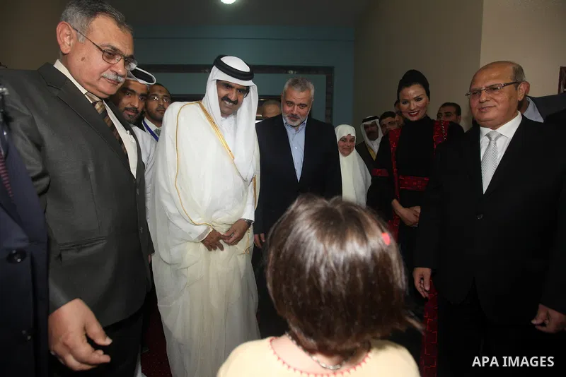 Qatari Emir Sheikh Hamad bin Khalifa al-Thani, Palestinian prime minister in Gaza strip, Ismail Haniyah and Qatar's First Lady Sheikha Mozah bint Nasser al-Missned attend a celebration at the Islamic University in Gaza c...