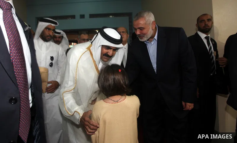 Qatari Emir Sheikh Hamad bin Khalifa al-Thani, Palestinian prime minister in Gaza strip, Ismail Haniyah and Qatar's First Lady Sheikha Mozah bint Nasser al-Missned attend a celebration at the Islamic University in Gaza c...