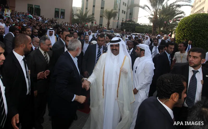 Qatari Emir Sheikh Hamad bin Khalifa al-Thani, Palestinian prime minister in Gaza strip, Ismail Haniyah and Qatar's First Lady Sheikha Mozah bint Nasser al-Missned attend a celebration at the Islamic University in Gaza c...