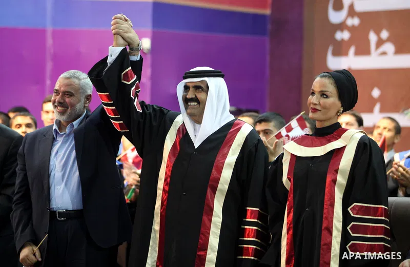 Qatari Emir Sheikh Hamad bin Khalifa al-Thani and Palestinian prime minister in Gaza strip, Ismail Haniyah attend a celebration at the Islamic University in Gaza city on October 23, 2012. The Emir of Qatar entered the Ga...