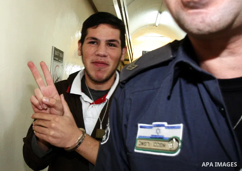 A Palestinian youth arrives to an Israeli court that was due to rule on his participation in al-Aqsa mosque demonstrations against an anti-Islam film made in the U.S. mocking Prophet Mohammad, in Jerusalem, Oct. 24, 2012...