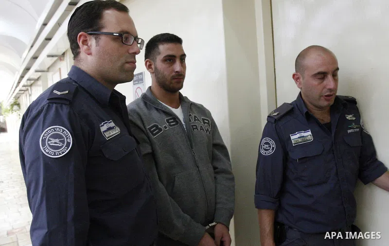 A Palestinian youth arrives to an Israeli court that was due to rule on his participation in al-Aqsa mosque demonstrations against an anti-Islam film made in the U.S. mocking Prophet Mohammad, in Jerusalem, Oct. 24, 2012...