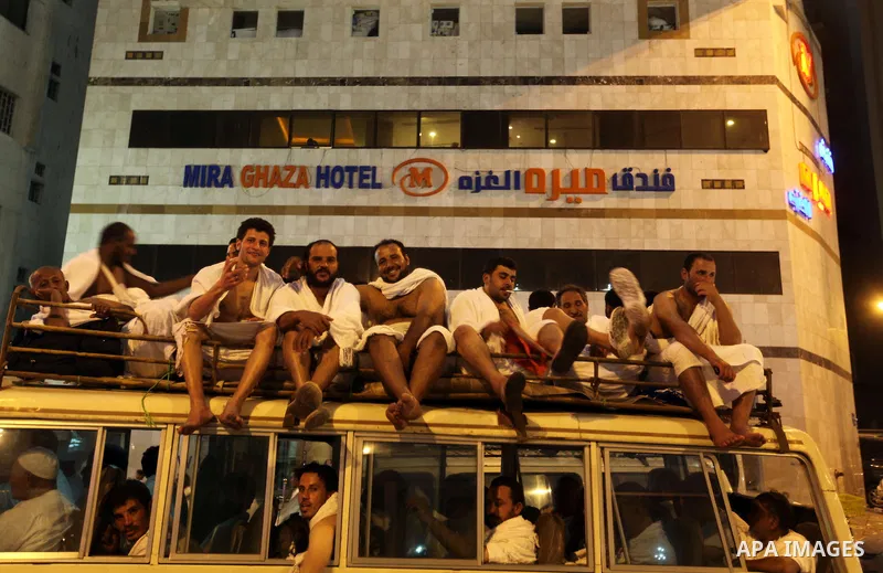 Muslim pilgrims sit on top of a bus on the way to Mount Arafat at the peak of the annual pilgrimage near the holy city of Mecca October 24, 2012. Nearly 3 million Muslim pilgrims started the first phase of the annual haj...