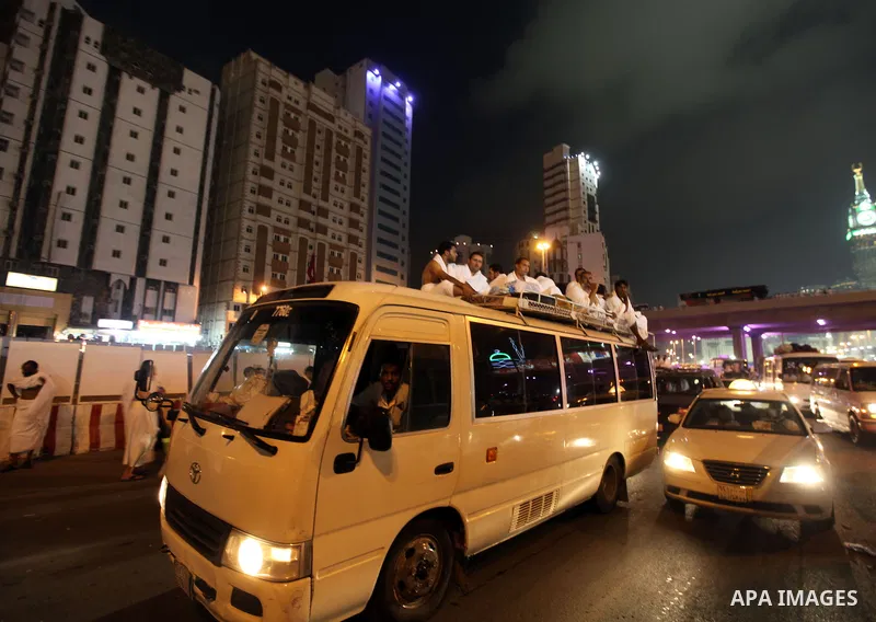 Muslim pilgrims sit on top of a bus on the way to Mount Arafat at the peak of the annual pilgrimage near the holy city of Mecca October 24, 2012. Nearly 3 million Muslim pilgrims started the first phase of the annual haj...