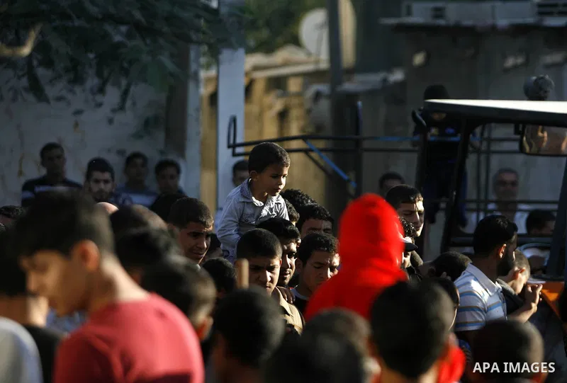 Palestinians slaughter a calf and sheep on the first day of the Muslim holiday of Eid al-Adha in Rafah in the southern Gaza Strip Oct. 26, 2012. Muslims around the world celebrate Eid al-Adha to mark the end of the haj b...