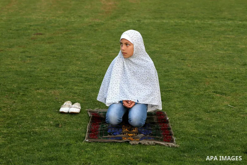 Palestinians attend Eid Al-Adha prayers on the first day of the Muslim holiday, at the Palestine Stadium in Gaza City, on October 26, 2012. Muslims around the world celebrate Eid al-Adha to mark the end of the haj by sla...