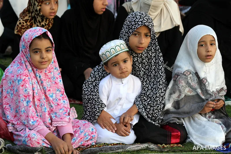 Palestinians attend Eid Al-Adha prayers on the first day of the Muslim holiday, at the Palestine Stadium in Gaza City, on October 26, 2012. Muslims around the world celebrate Eid al-Adha to mark the end of the haj by sla...