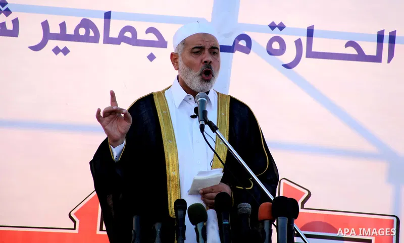 Palestinian Prime Minister in Gaza, Ismail Haniya delivers a speech during a mass prayer on the first day of the Muslim holiday of Eid al-Adha, at al-Nusairat, in the central Gaza Strip, on October 26, 2012. Muslims arou...