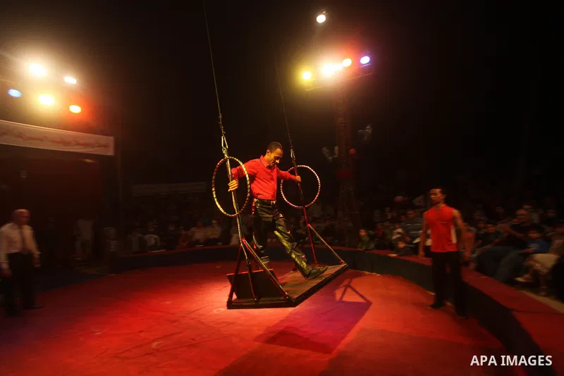 Palestinians watch members of the Egyptian National Circus, perform in Gaza City, Oct. 27, 2012. The Egyptian National Circus put on its first show of a month-long visit to the impoverished coastal territory, a sign of w...