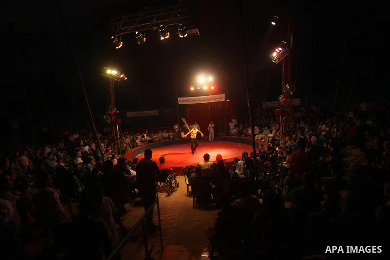 Palestinians watch members of the Egyptian National Circus, perform in Gaza City, Oct. 27, 2012. The Egyptian National Circus put on its first show of a month-long visit to the impoverished coastal territory, a sign of w...