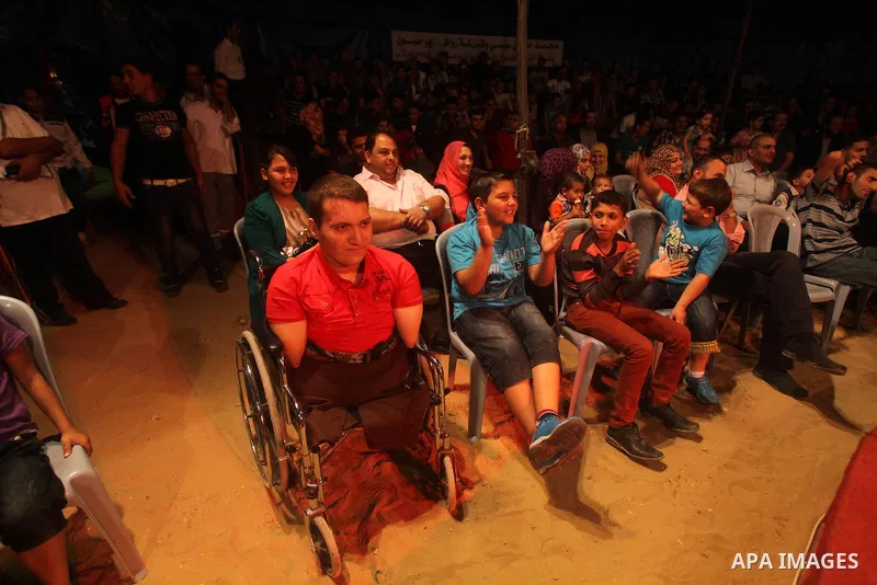 Palestinians watch members of the Egyptian National Circus, perform in Gaza City, Oct. 27, 2012. The Egyptian National Circus put on its first show of a month-long visit to the impoverished coastal territory, a sign of w...