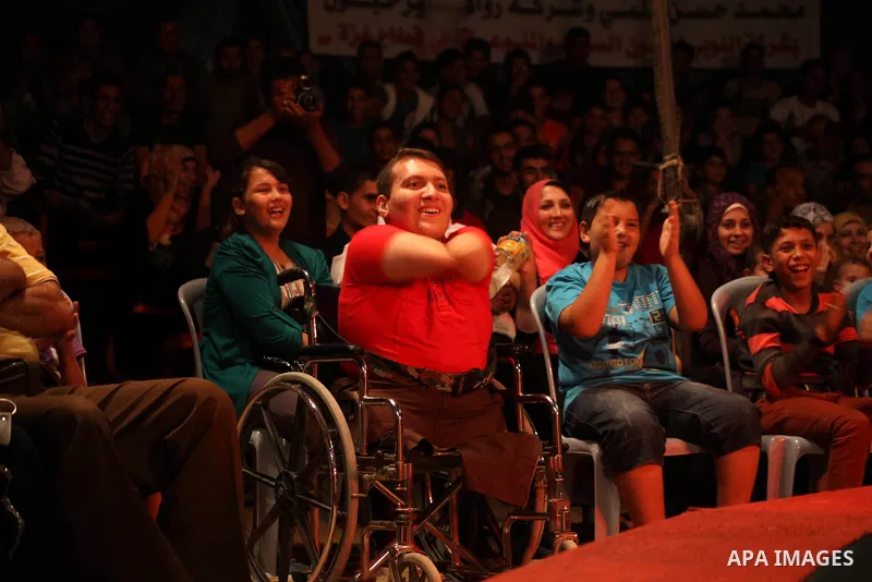 Palestinians watch members of the Egyptian National Circus, perform in Gaza City, Oct. 27, 2012. The Egyptian National Circus put on its first show of a month-long visit to the impoverished coastal territory, a sign of w...