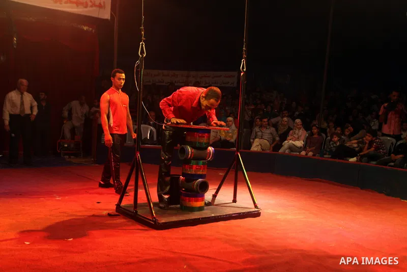 Palestinians watch members of the Egyptian National Circus, perform in Gaza City, Oct. 27, 2012. The Egyptian National Circus put on its first show of a month-long visit to the impoverished coastal territory, a sign of w...