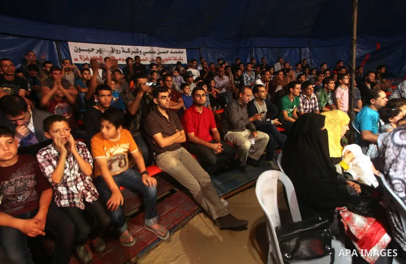 Palestinians watch members of the Egyptian National Circus, perform in Gaza City, Oct. 27, 2012. The Egyptian National Circus put on its first show of a month-long visit to the impoverished coastal territory, a sign of w...