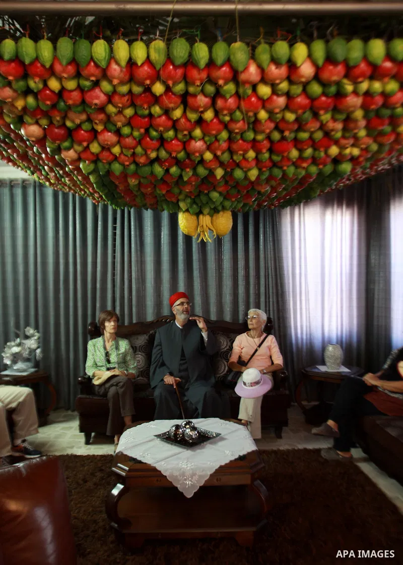 Palestinian Man from the ancient Samaritan community decorate a house, made from fresh fruit for the holy day of the Tabernacles or Sukkot in Mount Gerizim near the West Bank city of Nablus ,October 28, 2012. Photo by Ne...