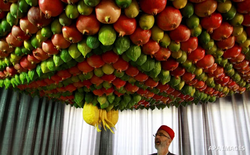 Palestinian Man from the ancient Samaritan community decorate a house, made from fresh fruit for the holy day of the Tabernacles or Sukkot in Mount Gerizim near the West Bank city of Nablus ,October 28, 2012. Photo by Ne...
