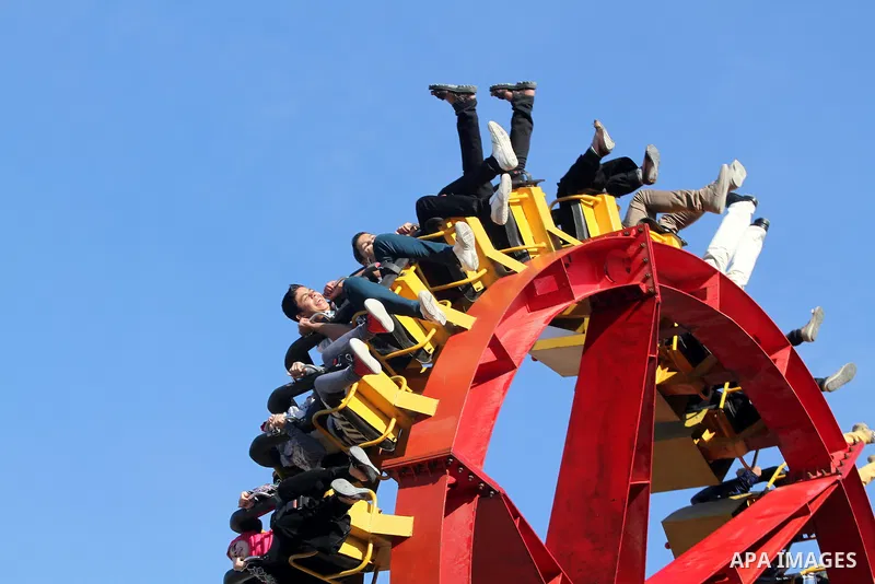 Palestinians enjoy themselves at an amusement park in Gaza City as the Muslim world celebrates the third day of the Eid al-Adha holiday on October 28, 2012. Eid al-Adha or "Feast of the Sacrifice" marks the end of the an...
