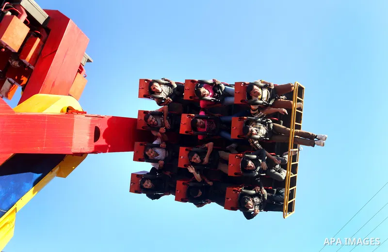 Palestinians enjoy themselves at an amusement park in Gaza City as the Muslim world celebrates the third day of the Eid al-Adha holiday on October 28, 2012. Eid al-Adha or "Feast of the Sacrifice" marks the end of the an...