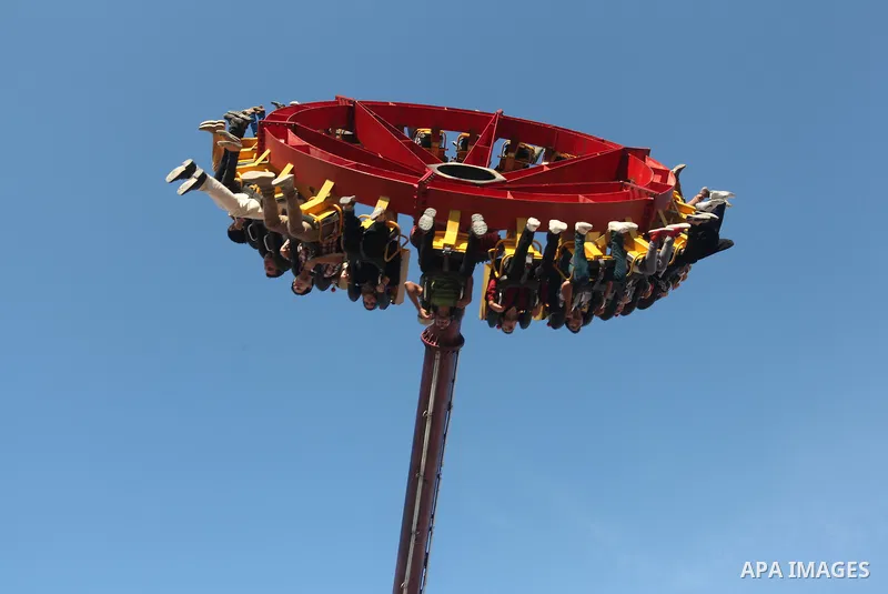 Palestinians enjoy themselves at an amusement park in Gaza City as the Muslim world celebrates the third day of the Eid al-Adha holiday on October 28, 2012. Eid al-Adha or "Feast of the Sacrifice" marks the end of the an...