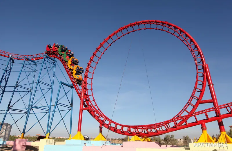 Palestinians enjoy themselves at an amusement park in Gaza City as the Muslim world celebrates the third day of the Eid al-Adha holiday on October 28, 2012. Eid al-Adha or "Feast of the Sacrifice" marks the end of the an...
