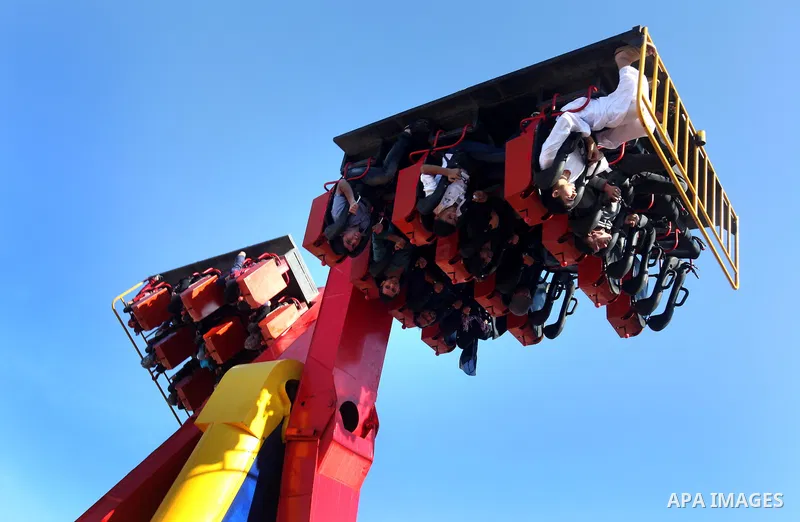 Palestinians enjoy themselves at an amusement park in Gaza City as the Muslim world celebrates the third day of the Eid al-Adha holiday on October 28, 2012. Eid al-Adha or "Feast of the Sacrifice" marks the end of the an...