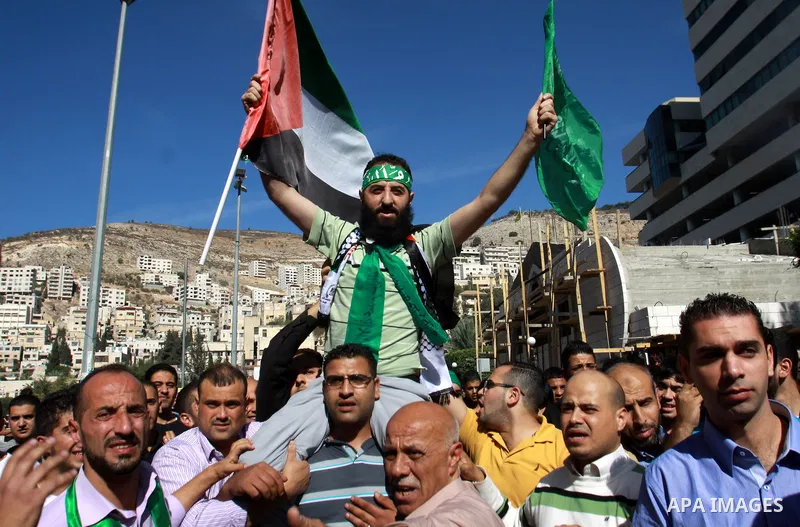Palestinian Hamas member Hassan Safadi is greeted by his relatives as he arrive in the West Bank city of Nablus after his release from Israeli jail, Monday, Oct. 29, 2012. Hassan reportedly went on an on-and-off hunger s...
