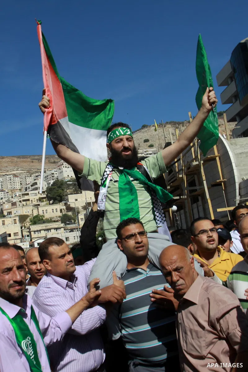 Palestinian Hamas member Hassan Safadi is greeted by his relatives as he arrive in the West Bank city of Nablus after his release from Israeli jail, Monday, Oct. 29, 2012. Hassan reportedly went on an on-and-off hunger s...